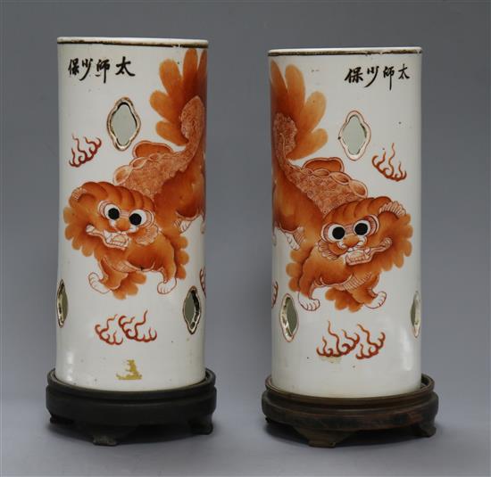 A pair of early 20th century Chinese lion-dog porcelain hat stands total height including stands 31.5cm